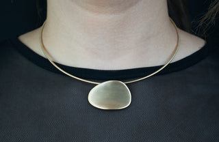 woman wearing 18k gold plated pendant necklace