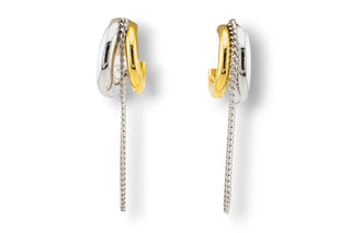 Pair of gold and silver stainless steel hoop earrings with a small chain in the middle