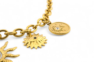 Trendy gold-plated stainless-steel charm necklace on a white background